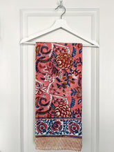 Load image into Gallery viewer, Pink and Blue Floral Blockprint tablecloth hanging on a white door