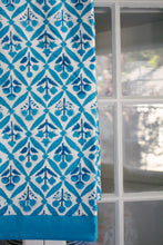 Load image into Gallery viewer, Blue and white patterned fabric draped over a surface